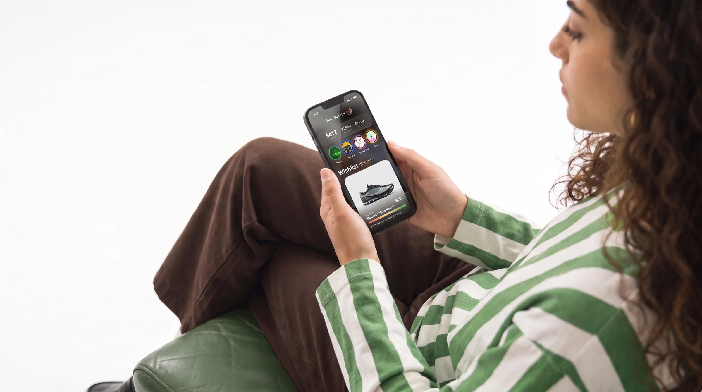 Looking over a shoulder at the Stak home screen on a phone.